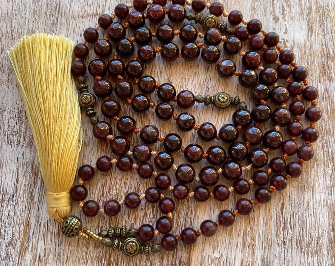 Garnet mala with golden tassel